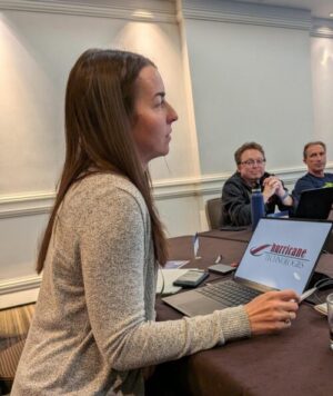 Owner, Kara Petti, at an IT conference presenting to group